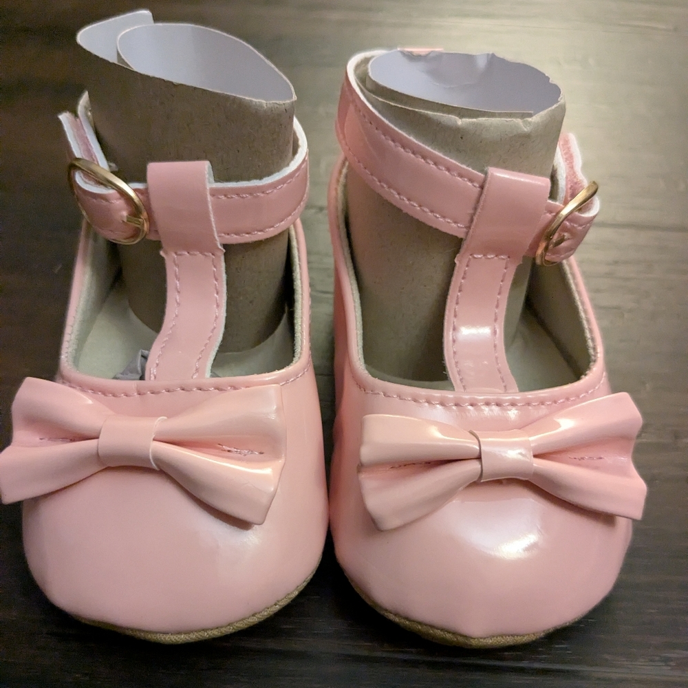 Pink toddler flats with bow accent